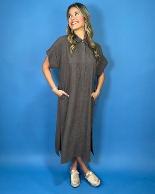 Charcoal gray collared midi dress with short sleeves, relaxed silhouette, hidden button placket, and side slits.