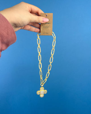 Shop the Chunky MOP Matte Gold Necklace featuring a mother-of-pearl quatrefoil pendant, chunky matte gold paperclip chain, and adjustable fit.