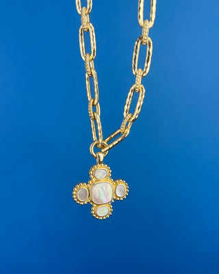 Shop the Chunky MOP Matte Gold Necklace featuring a mother-of-pearl quatrefoil pendant, chunky matte gold paperclip chain, and adjustable fit.