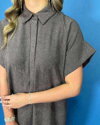 Charcoal gray collared midi dress with short sleeves, relaxed silhouette, hidden button placket, and side slits.