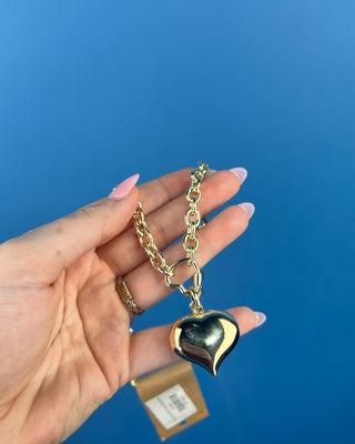 Shop the Chunky Gold Heart Necklace featuring a polished gold-tone chain, bold puffed heart pendant, and timeless statement design for every outfit.