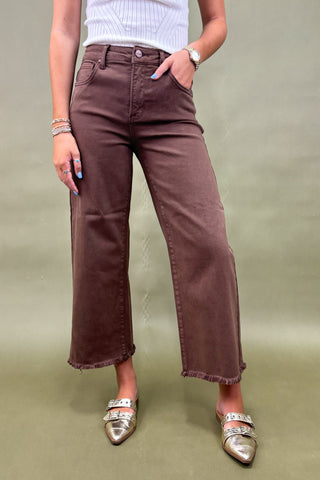 Women’s high-rise wide leg pants in chocolate brown with raw hem