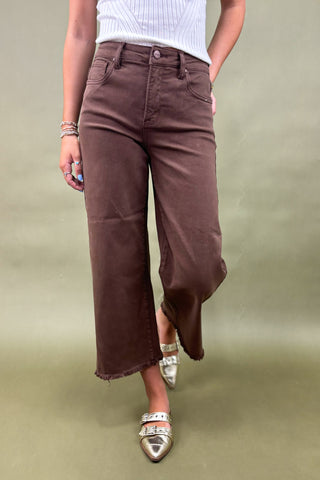 Women’s high-rise wide leg pants in chocolate brown with raw hem