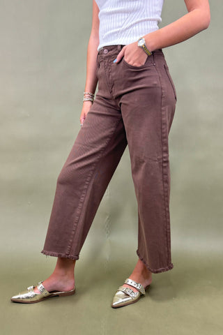 Women’s high-rise wide leg pants in chocolate brown with raw hem