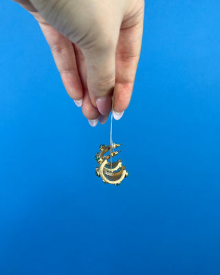Shop the Gold with Jade Stone Earrings featuring textured gold hoops with jade-inspired green stones for timeless statement style.