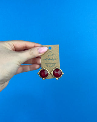 Shop the Gold & Burgundy Earrings featuring faceted burgundy stones in polished gold-tone settings for timeless boutique style.