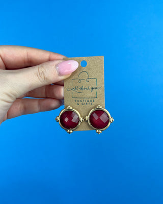 Shop the Gold & Burgundy Earrings featuring faceted burgundy stones in polished gold-tone settings for timeless boutique style.