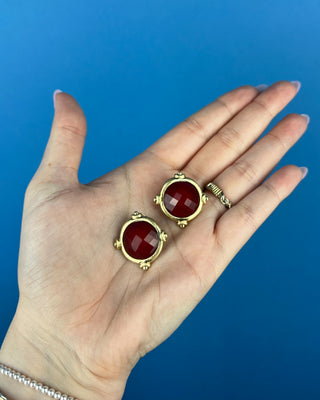 Shop the Gold & Burgundy Earrings featuring faceted burgundy stones in polished gold-tone settings for timeless boutique style.