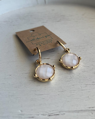 Shop the Gold & White Earrings featuring faceted white stone drops, gold-tone hoops, and a timeless design perfect for everyday wear and special occasions.