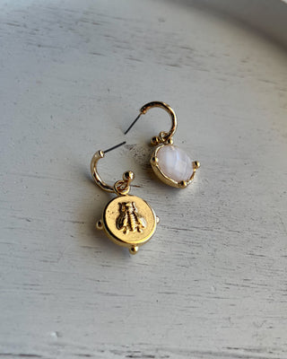 Shop the Gold & White Earrings featuring faceted white stone drops, gold-tone hoops, and a timeless design perfect for everyday wear and special occasions.