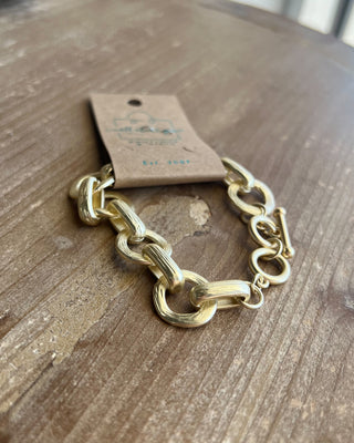 Shop the Chunky Matte Gold Bracelet featuring oversized mixed links, a matte gold finish, and an adjustable toggle closure for effortless everyday style.