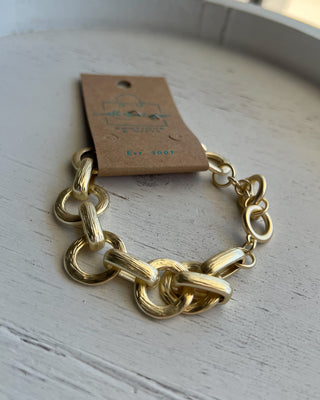 Shop the Chunky Matte Gold Bracelet featuring oversized mixed links, a matte gold finish, and an adjustable toggle closure for effortless everyday style.