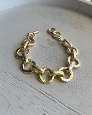 Shop the Chunky Matte Gold Bracelet featuring oversized mixed links, a matte gold finish, and an adjustable toggle closure for effortless everyday style.