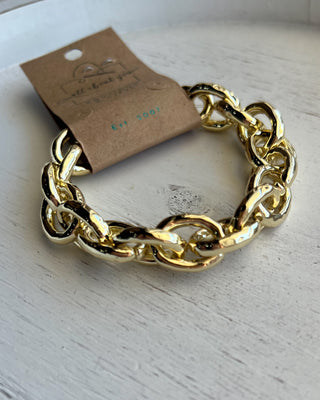 Shop the Gold Link Bracelet featuring oversized polished chain links and a timeless gold finish for the perfect everyday statement accessory.