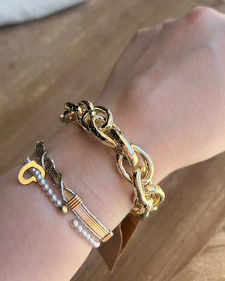 Shop the Gold Link Bracelet featuring oversized polished chain links and a timeless gold finish for the perfect everyday statement accessory.