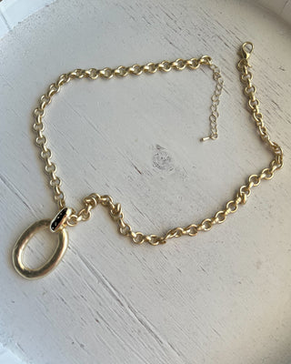 Shop the Matte Gold Chunky Necklace featuring a bold matte chain, organic oval pendant, crystal accent, and adjustable fit for effortless everyday style.
