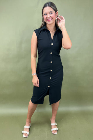 Woman wearing a black dress with white buttons against a green background