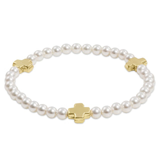 Pearl bracelet with gold star-shaped clasps on a white background