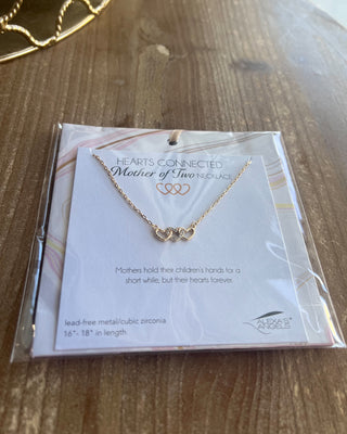 Shop the Mother Of... Hearts Connected Bracelet Collection featuring meaningful heart designs, sparkling cubic zirconia, and adjustable gift-ready bracelets for moms.