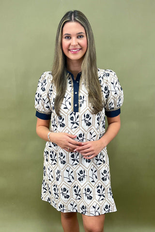 Woman wearing a floral dress with a green background