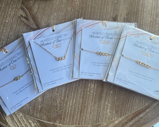 Shop the Mother Of... Hearts Connected Bracelet Collection featuring meaningful heart designs, sparkling cubic zirconia, and adjustable gift-ready bracelets for moms.
