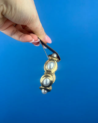 Shop the Gold & Pearl Stretch Bracelet featuring antique gold accents, luminous faux pearls, and a comfortable stretch fit for timeless elegance.