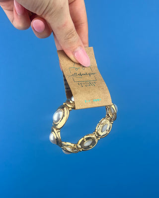 Shop the Gold & Pearl Stretch Bracelet featuring antique gold accents, luminous faux pearls, and a comfortable stretch fit for timeless elegance.