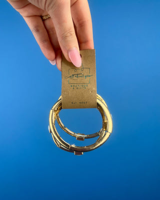 Shop the Alyssa Matte Gold Bracelet Set featuring three coordinating matte gold bangles with elegant white stone accents for effortless everyday style.