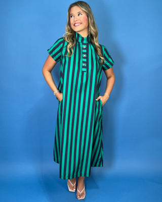 Emerald green and navy striped satin midi dress with high neckline, short sleeves, and statement button detail.