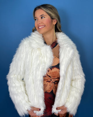 Ivory faux fur cropped jacket with plush textured fabric, long sleeves, open front, and oversized collar.