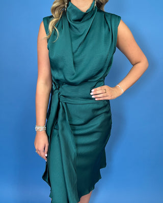 Emerald green satin midi dress with a draped cowl neckline, sleeveless design, and flattering tie-waist detail.