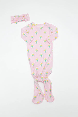 Baby outfit with pink floral pattern on a white background