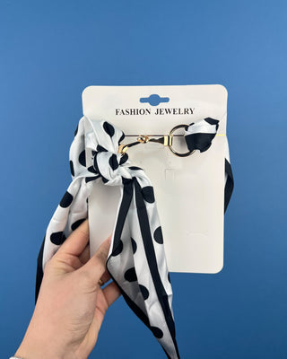 Shop the Horse Bit Scarf Necklace featuring elegant gold-tone hardware and a silky satin scarf. Available in multiple colors and stylish prints.