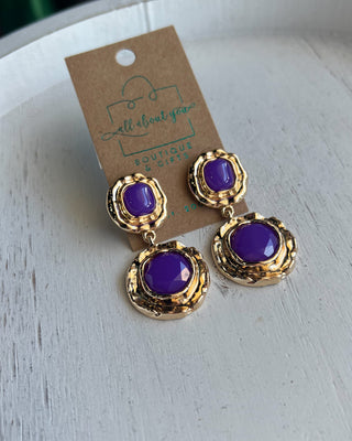 Shop the Lauren Gold & Purple Earrings featuring vibrant purple stones, textured gold-tone details, and a bold double-drop design perfect for LSU game day.