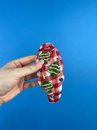 Shop the Red Gingham Christmas Headband featuring beaded Christmas trees, sparkling rhinestones, and a festive knotted design. Perfect for holiday outfits!