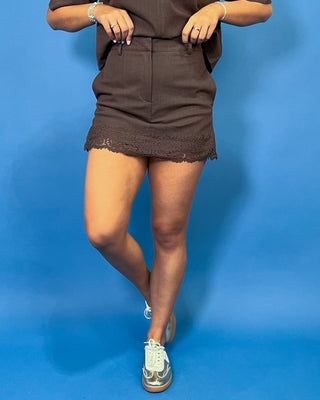 Chocolate brown collared top with short sleeves, paired with a matching lace-trim mini skort.