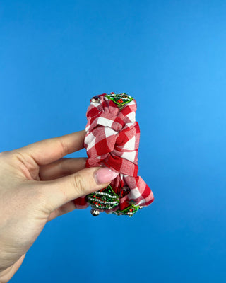 Shop the Red Gingham Christmas Headband featuring beaded Christmas trees, sparkling rhinestones, and a festive knotted design. Perfect for holiday outfits!