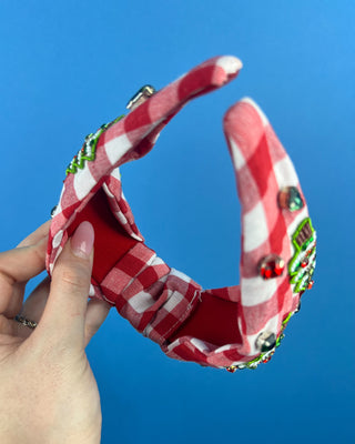 Shop the Red Gingham Christmas Headband featuring beaded Christmas trees, sparkling rhinestones, and a festive knotted design. Perfect for holiday outfits!