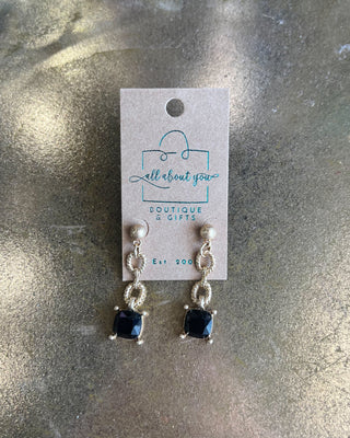Shop the Adrian Black Stone Earrings featuring gold-tone textured links, polished ball studs, and faceted black square stones. Perfect for any occasion!