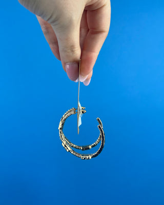 Shop the Gabi Red Stone Hoops featuring gold-tone hoops, sparkling clear rhinestones, and rich red rectangular stones. Perfect for holidays and everyday style!