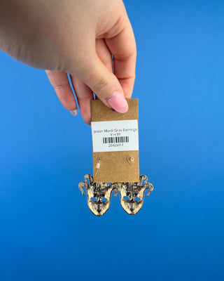Shop the Jester Mardi Gras Earrings featuring glittery purple, green, and gold jester masks. Perfect for Mardi Gras parades, Fat Tuesday, and festive outfits.