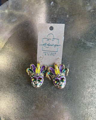 Shop the Jester Mardi Gras Earrings featuring glittery purple, green, and gold jester masks. Perfect for Mardi Gras parades, Fat Tuesday, and festive outfits.