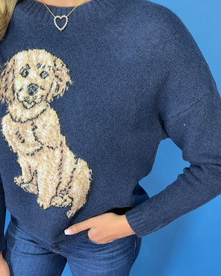 Navy blue knit sweater featuring a textured golden retriever design, crew neckline, and long sleeves.