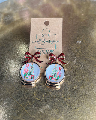 Shop the Christmas Nutcracker Snow Globe Bow Earrings at All About You Boutique! Festive red glitter bows and charming Christmas snow globe designs.