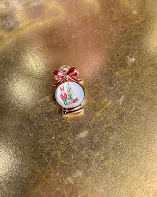 Shop the Christmas Nutcracker Snow Globe Bow Earrings at All About You Boutique! Festive red glitter bows and charming Christmas snow globe designs.