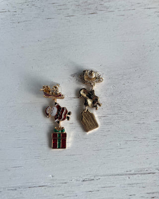Shop the Christmas Santa Sleigh Earrings at All About You Boutique! Festive glittery Santa, sleigh, and gift dangle earrings perfect for holiday outfits.