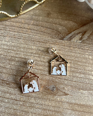 Shop the Nativity Scene Gold Drop Earrings at All About You Boutique! Beautiful gold and white Christmas earrings featuring Mary, Joseph, and baby Jesus.