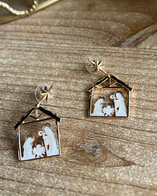 Shop the Nativity Scene Gold Drop Earrings at All About You Boutique! Beautiful gold and white Christmas earrings featuring Mary, Joseph, and baby Jesus.
