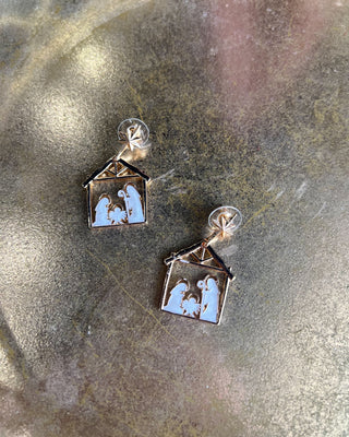 Shop the Nativity Scene Gold Drop Earrings at All About You Boutique! Beautiful gold and white Christmas earrings featuring Mary, Joseph, and baby Jesus.