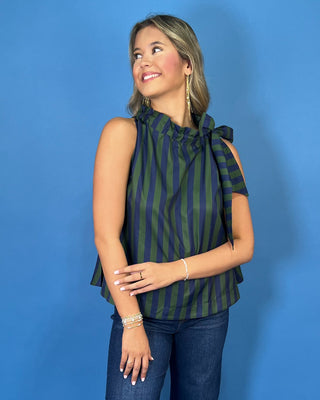 Navy and green striped sleeveless top with a ruffle neckline, statement shoulder tie, and relaxed silhouette.